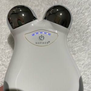 Nuface mini facial toning device.